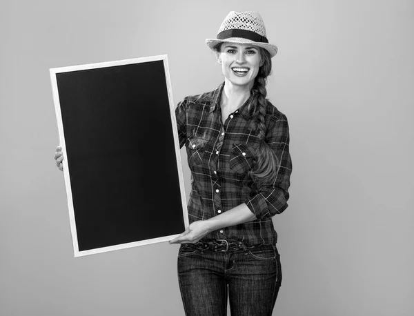 Portrait Smiling Young Woman Grower Checkered Shirt Showing Blank Board — Stock Photo, Image