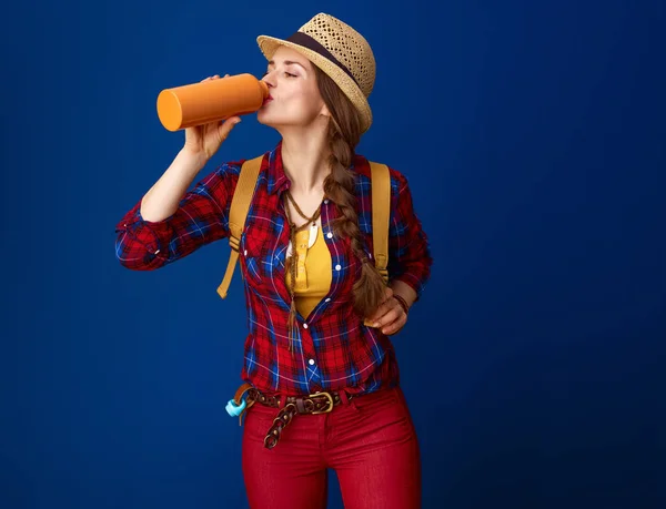 Young Traveler Woman Plaid Shirt Drinking Water Bottle Blue Background — Stock Photo, Image