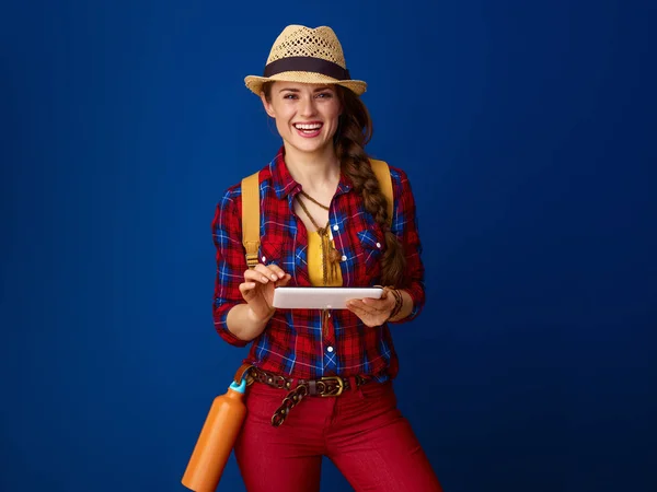 Happy Active Tourist Woman Backpack Using Tablet Isolated Blue Background — Stock Photo, Image