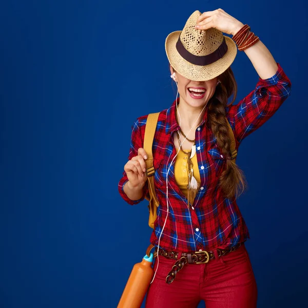 Happy Active Tourist Woman Backpack Headphones Listening Music Hiding Hat — Stock Photo, Image