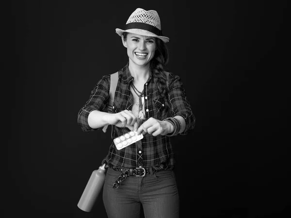 Happy Adventure Tourist Woman Backpack Takes Pill Out Package — Stock Photo, Image