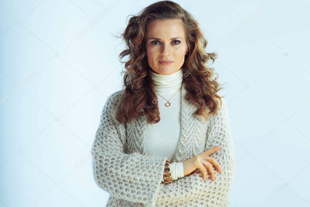 elegant housewife isolated on winter light blue background