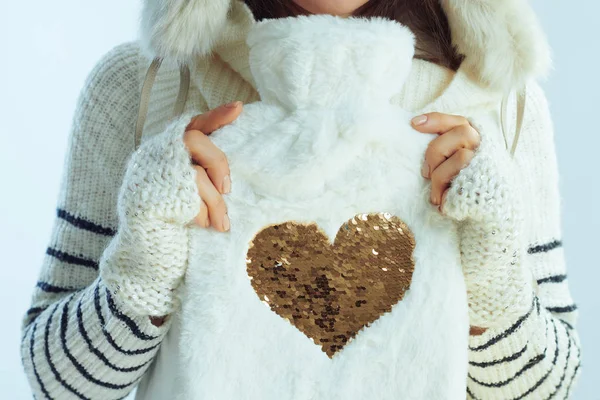 Closeup on modern woman showing cute hot water filling warmer — Stock Photo, Image