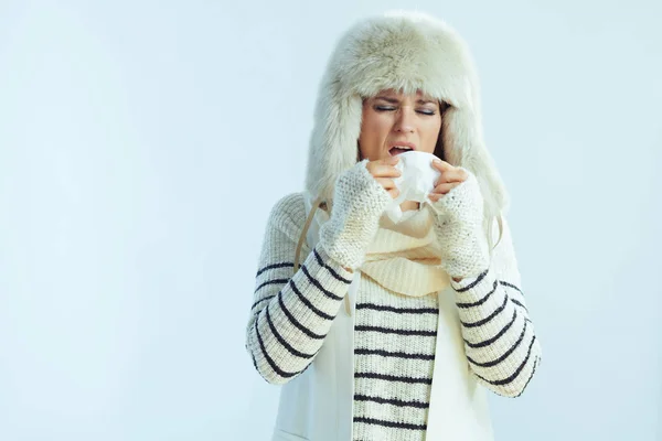 Young female with napkin sneezing — 스톡 사진