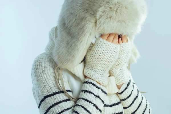 Sad woman crying isolated on winter light blue background — Stock Photo, Image