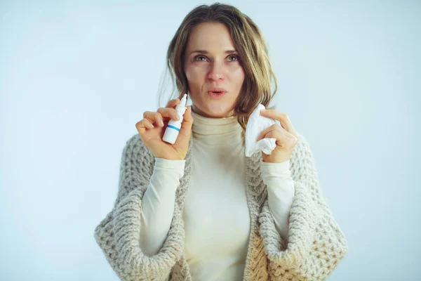 Woman with napkin using nasal spray and feeling relief — 스톡 사진
