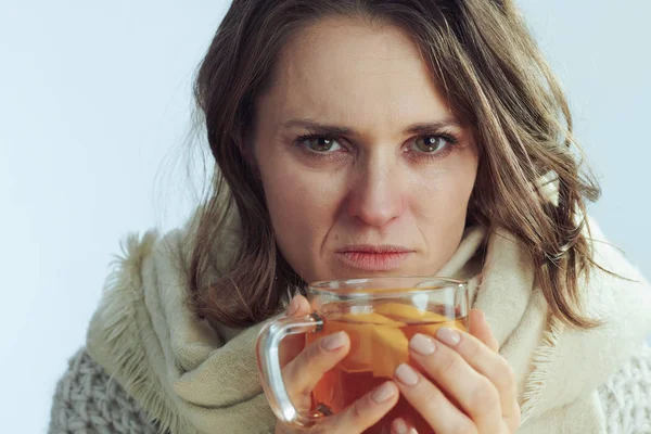 Unhappy ill elegant 40 years old woman drinking cup of tea — Stock Photo, Image