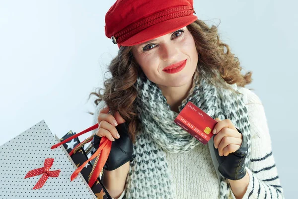 Smiling trendy female with shopping bags and credit card — 스톡 사진