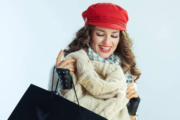 Smiling elegant 40 years old woman shopper checking purchases — 스톡 사진