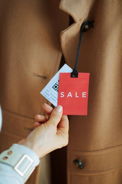 Closeup Woman Modern Fashion Boutique Examines Sale Price Tag Beige — Stock Photo, Image