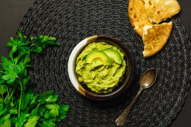 Herbs hummus in bowl