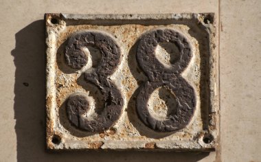 Old retro cast iron plate number 38 clipart