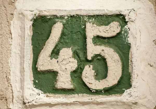 Old retro cast iron plate number 45 — Stock Photo, Image