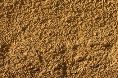 Koyu sarı ev sıvalı duvar