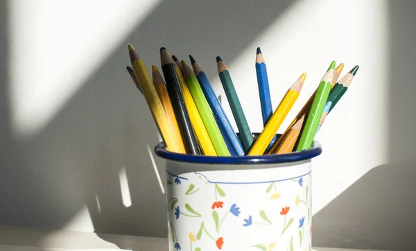 Metal mug with colored pencils — Stock Photo, Image