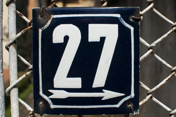 Weathered enameled plate number 27 — Stock Photo, Image