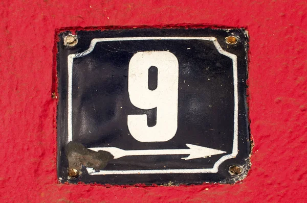 Weathered enameled plate number 9 — Stock Photo, Image