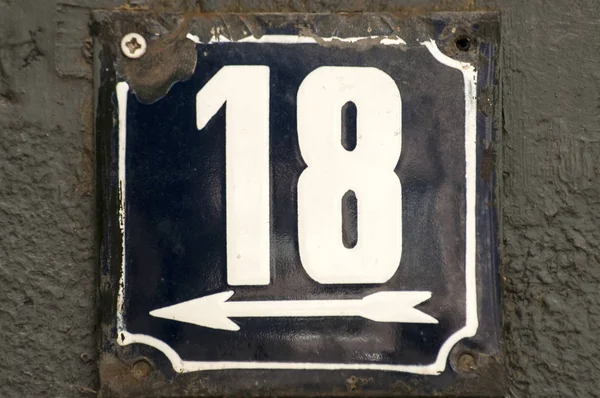 Weathered enameled plate number 18 — Stock Photo, Image