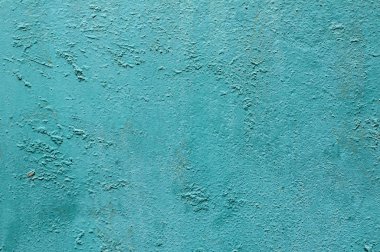 Grunge yıpranmış kırık, boyalı duvar, turkuaz arka plan olarak yakın plan.