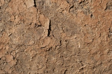 Adobe kil yıpranmış kırsal bağ evi duvarı kil arka plan olarak kapanıyor