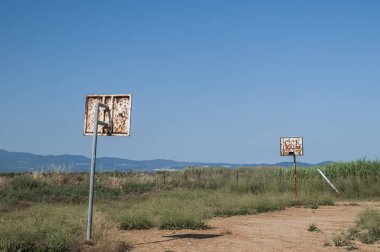 Grunge basketball board with hoop on abandoned basketball court in the beach
