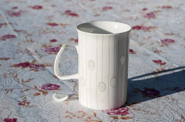 White Porcelain Milk Mug Broken Handle Closeup Covered Table — ストック写真