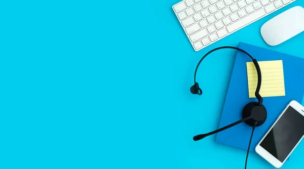 Voip Helpdesk Headset Keyboard Computer Notebook Mouse Isolated Blue Background — Stock Photo, Image