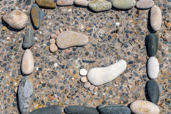 Stone footprints are enclosed in a frame — Stock Photo, Image