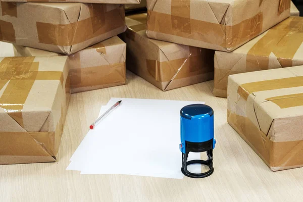 Stamp blue for documents paper and boxes with bundles sealed — Stock Photo, Image