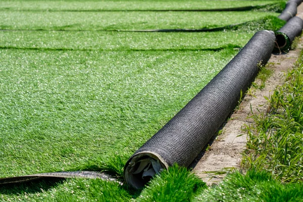 Green artificial covering of synthetic grass in rolls — 스톡 사진