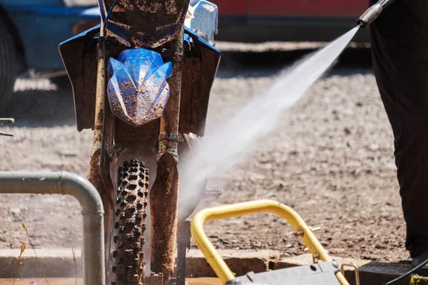 cross-bike washing after the competition of washing dirt from the front