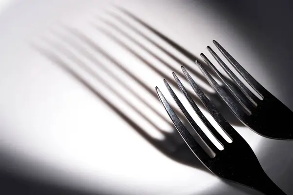Two Forks Pulled Out Light Spot Cast Long Shadows White — Stock Photo, Image