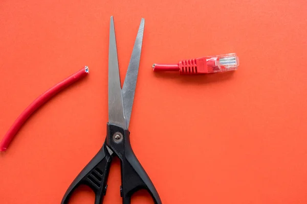 Pair Scissors Cut Connector Red Cable Red Background Damage Cable — Stock Photo, Image
