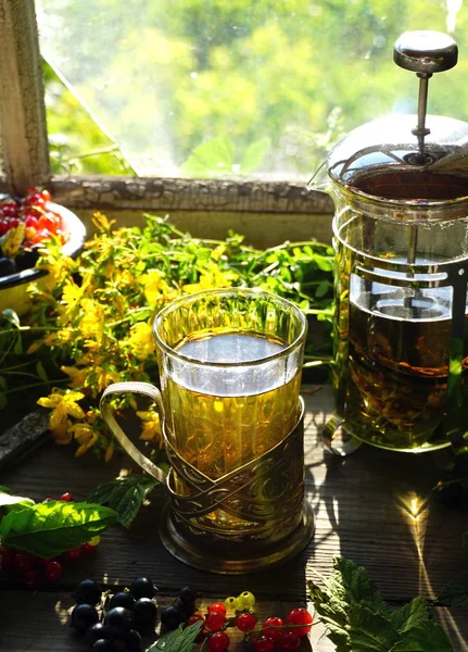 A glass with herbal tea — Stock Photo, Image