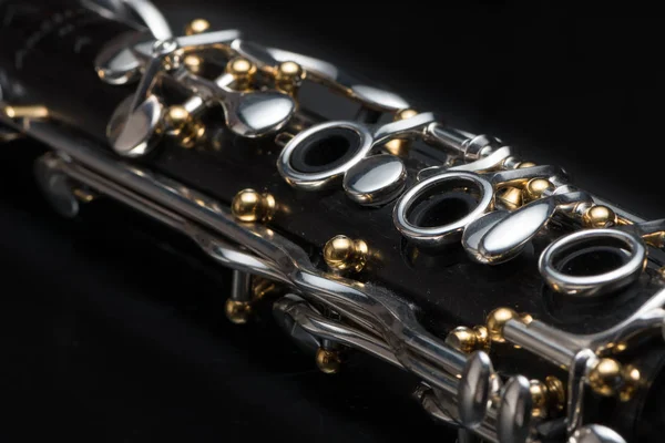 Details of a clarinet with silver keys and golden sockets — Stock Photo, Image