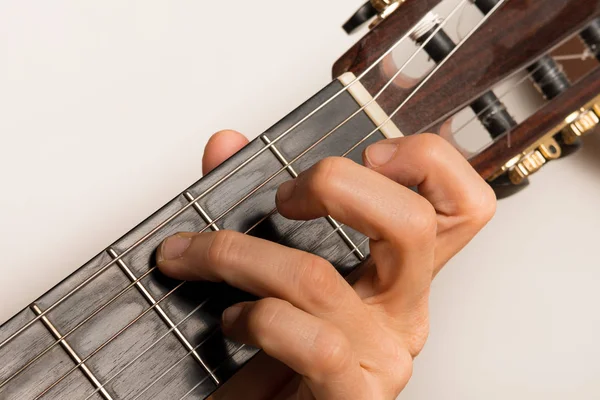 Closeup of someone playing the guitar, hand strings — Stock Photo, Image