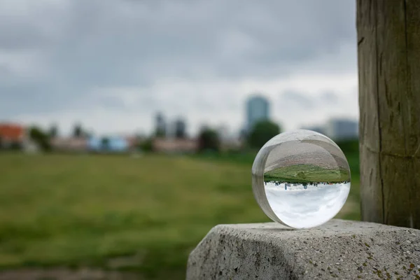 Skyline of the high buildings in 22nd district of Vienna, Austria through glass ball