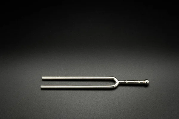 A tuning fork 440 Hz on a black background — 스톡 사진