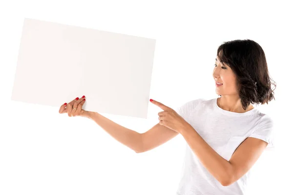 Woman pointing at empty board — Stock Photo, Image