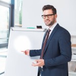 Businessman pointing at whiteboard