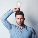 Young businessman with light bulb