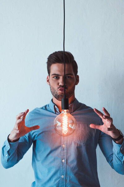young businessman with light bulb