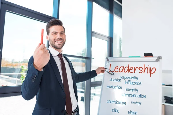Smiling businessman with whiteboard — Stock Photo