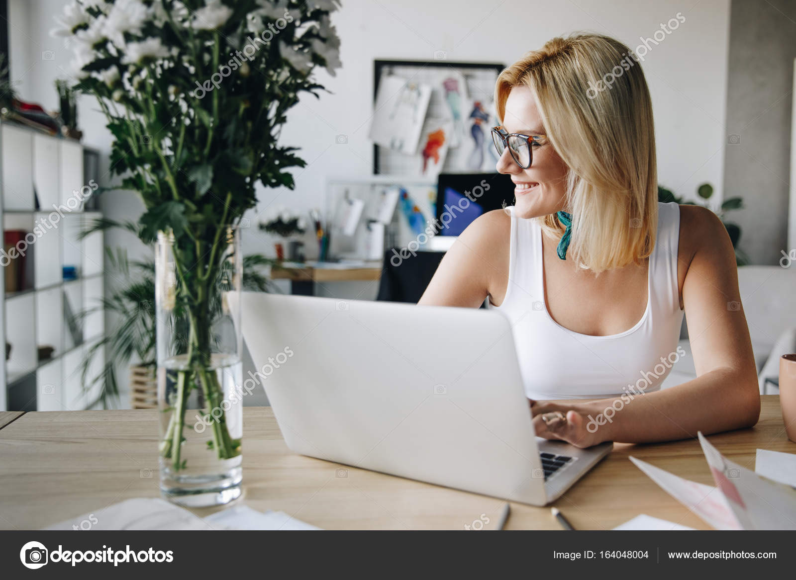 Fashion designer using laptop — Stock Photo © IraGirich #164048004