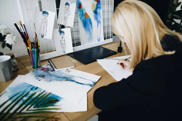 Fashion designer working with sketches — Stock Photo, Image