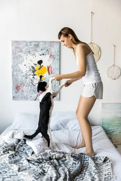 Side View Young Woman Puppy Dancing Bed Together Morning — Stock Photo, Image