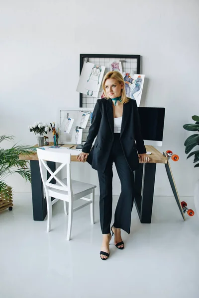 Young fashion designer at workplace — Stock Photo