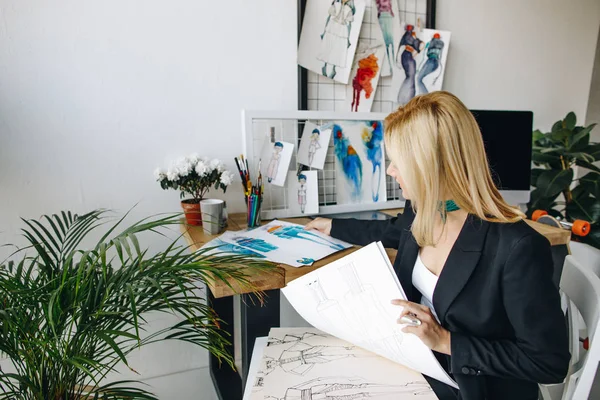 Fashion designer working with sketches — Stock Photo