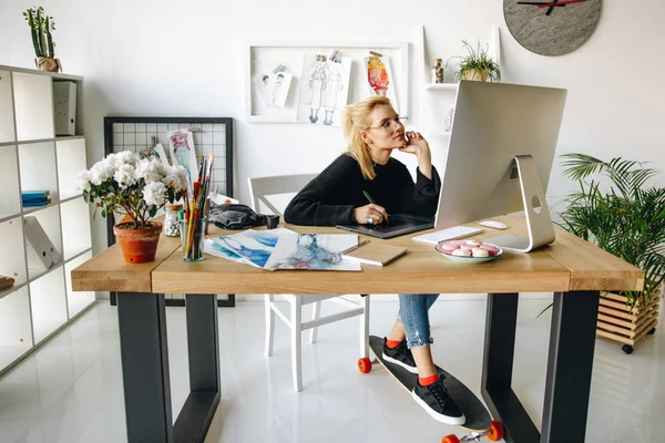 Fashion designer working with devices — Stock Photo