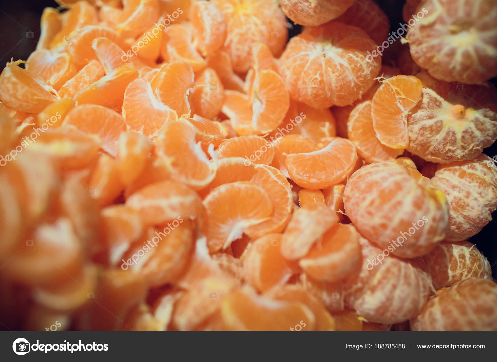 To clean tangerine. To remove a peel from tangerine. Cleaning of a madarin  of a peel. Stock Photo by ©vershinin.photo 188785458